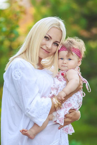 Happy family playing in autumn park outdoors — Stock Photo, Image