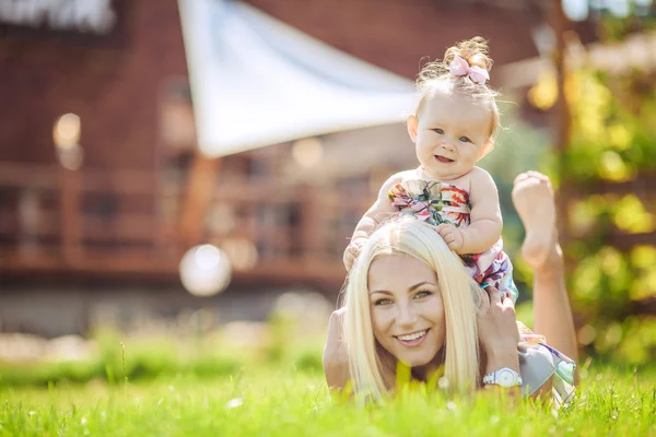 Happy family playing in autumn park outdoors — Stock Photo, Image