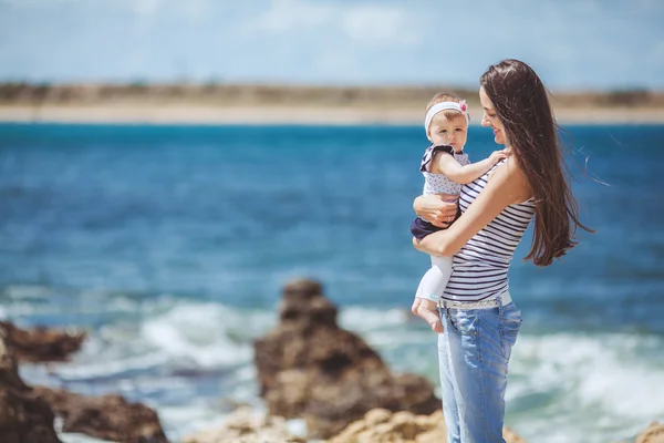 Portrait of Happy Family of two mother and child having fun by the Sea shore — Stock Photo, Image