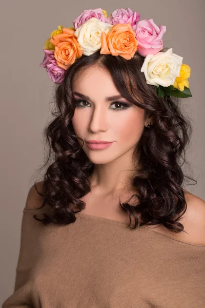 Studio portrait of a beautiful woman with wreath — Stock Photo, Image