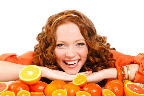 Portrait of attractive caucasian smiling woman isolated on white studio shot with oranges — Stock Photo, Image