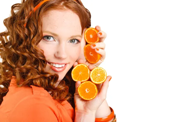 Portrait of attractive caucasian smiling woman isolated on white studio shot with oranges — Stock Photo, Image
