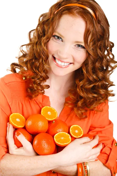 Portrait of attractive caucasian smiling woman isolated on white studio shot with oranges — Stock Photo, Image