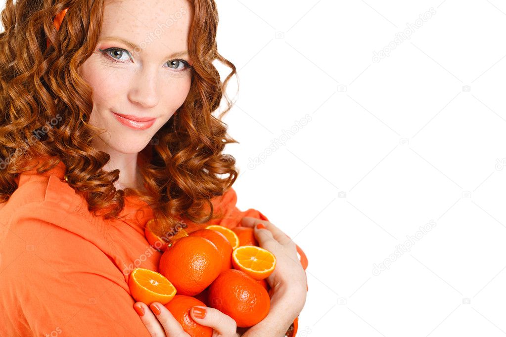 Portrait of attractive caucasian smiling woman isolated on white studio shot with oranges