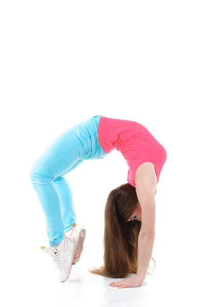 Mujer joven haciendo ejercicios de gimnasia —  Fotos de Stock