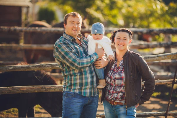 Young happy family having fun at countryside — Stock Photo, Image