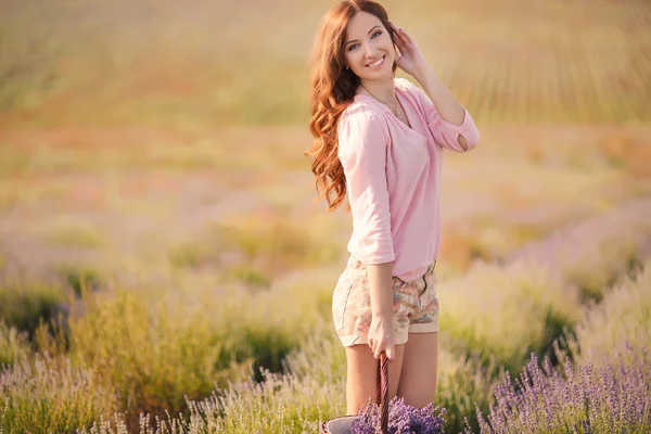 Beautiful girl on the lavender field. — Stock Photo, Image