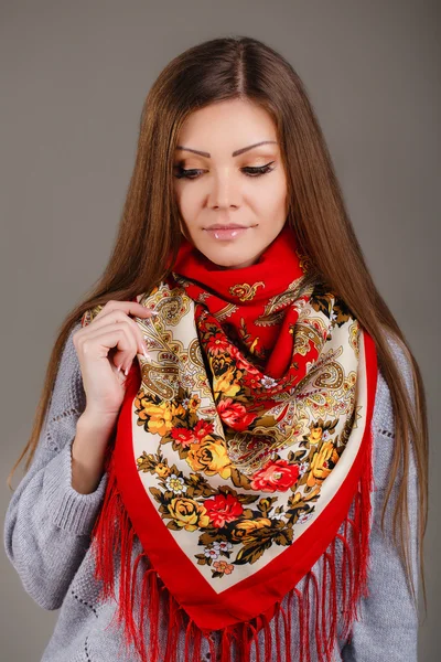 Portrait of a beautiful young woman with a scarf. — Stock Photo, Image