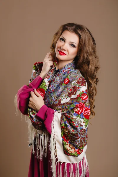 Portrait of a beautiful young woman with a scarf. Stock Photo