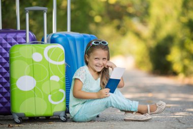 Beautiful young lady travelling with a suitcase