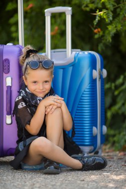 Beautiful young lady travelling with a suitcase