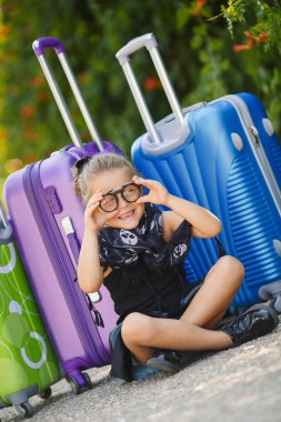 Beautiful young lady travelling with a suitcase