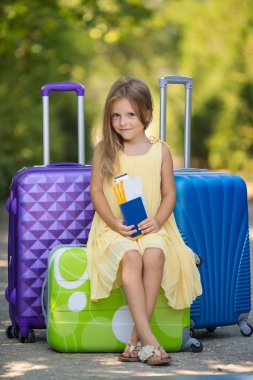 Beautiful young lady travelling with a suitcase