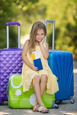 Beautiful young lady travelling with a suitcase