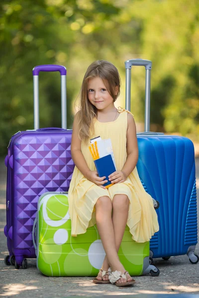 Beautiful young lady travelling with a suitcase — 스톡 사진