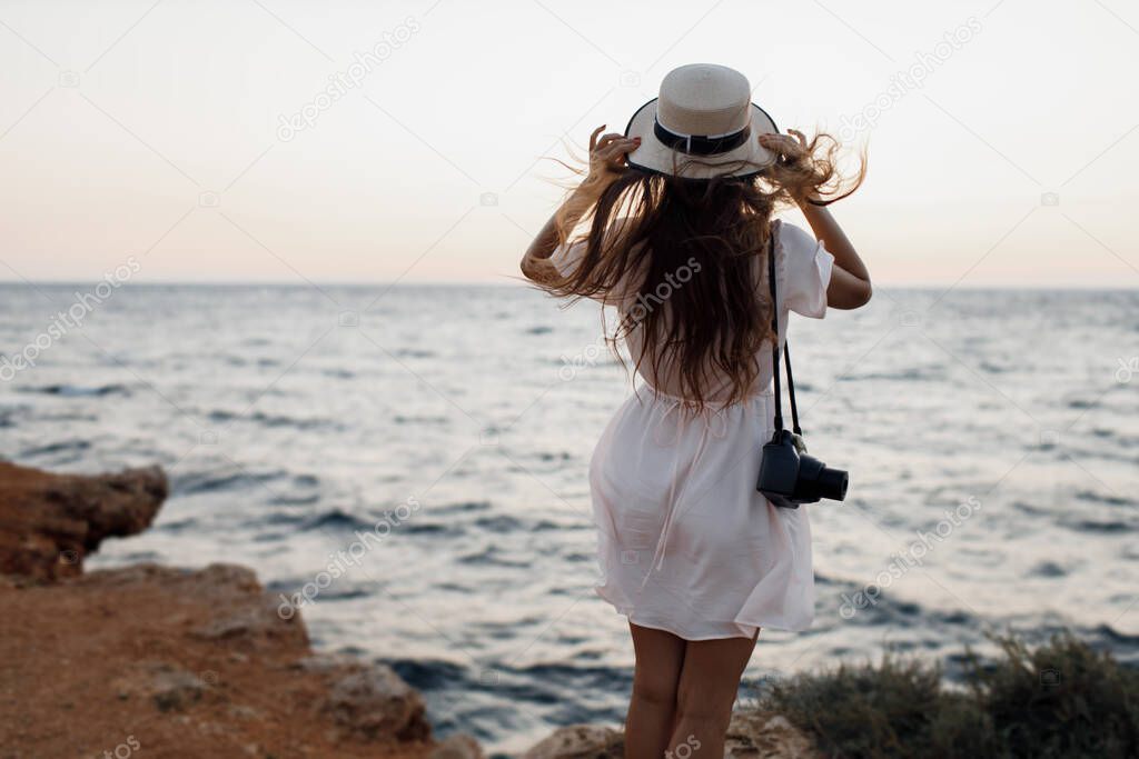 happy young woman with camera outdoor