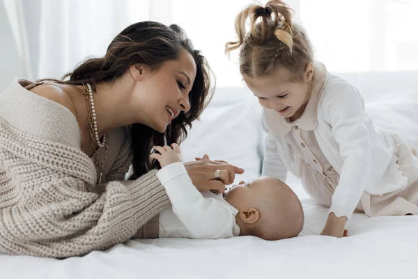 Mother and lovely baby and daughter indoor at home — 스톡 사진
