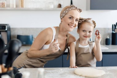 mother and daughter cooking and baking in the kitchen. High-quality photo