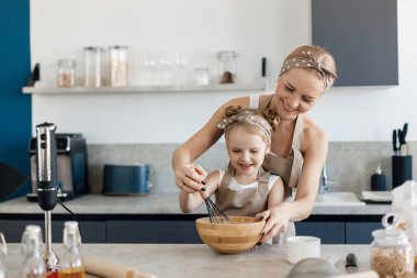 mother and daughter cooking and baking in the kitchen. High-quality photo