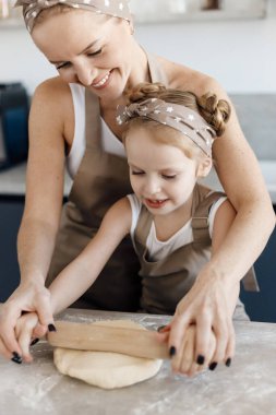 mother and daughter cooking and baking in the kitchen. High-quality photo