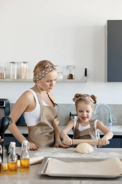 mother and daughter cooking and baking in the kitchen. High-quality photo