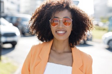 Smiling afro American woman portrait outdoors. High quality photo