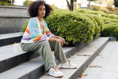 Joyful African American woman portrait outdoors. High quality photo