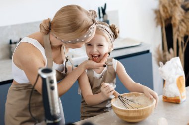 mother and daughter cooking and baking in the kitchen. High-quality photo