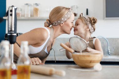 preschool young girl baking at home. High quality photo