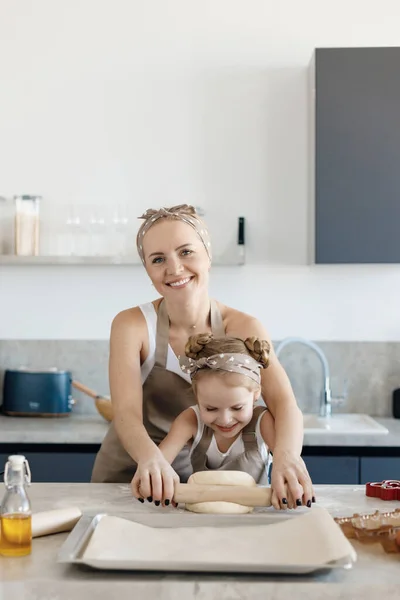 mother and daughter cooking and baking in the kitchen. High-quality photo