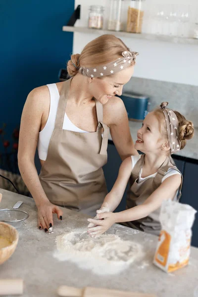 mother and daughter cooking and baking in the kitchen. High-quality photo