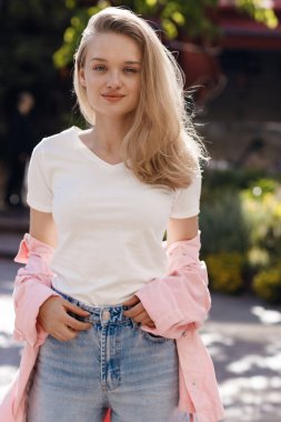 young pretty blond woman outdoor. High quality photo