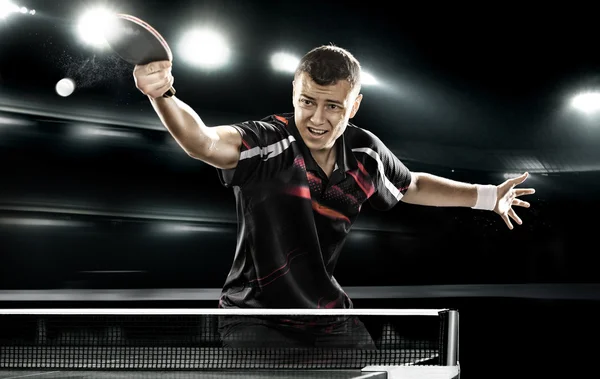 Sports man tennis-player on black background — Stock Photo, Image