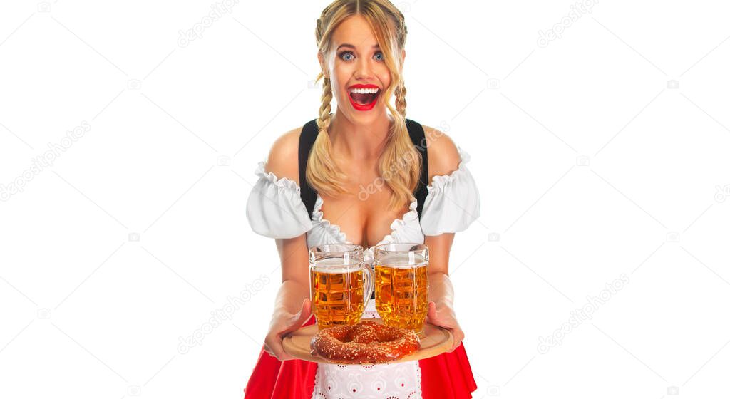 Young sexy Oktoberfest girl waitress, wearing a traditional Bavarian or german dirndl, serving big beer mugs with drink isolated on white background.