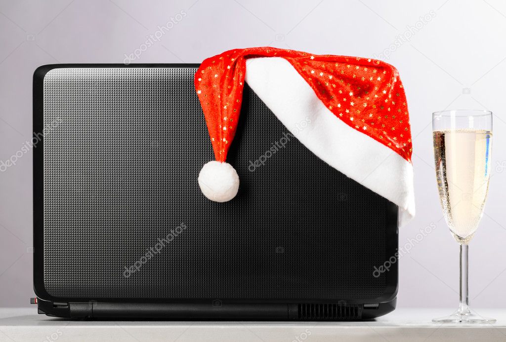 laptop with santa hat and wine