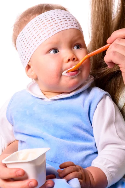 Woman is feeding her baby — Stock Photo, Image