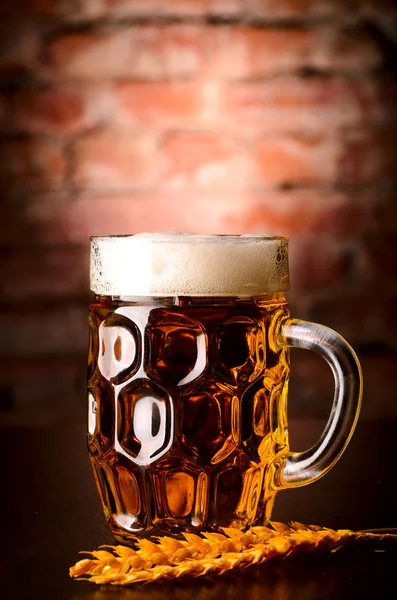 Glass of lager on table — Stock Photo, Image