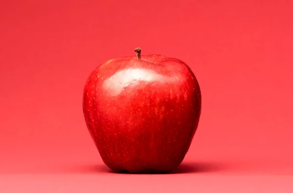 Delicious apple on red — Stock Photo, Image