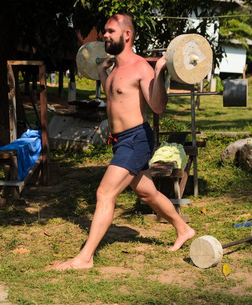 Training with barbell outdoors