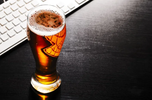 Glass of lager beer on table — Stock Photo, Image