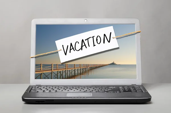 Portatile con nota di vacanza — Foto Stock