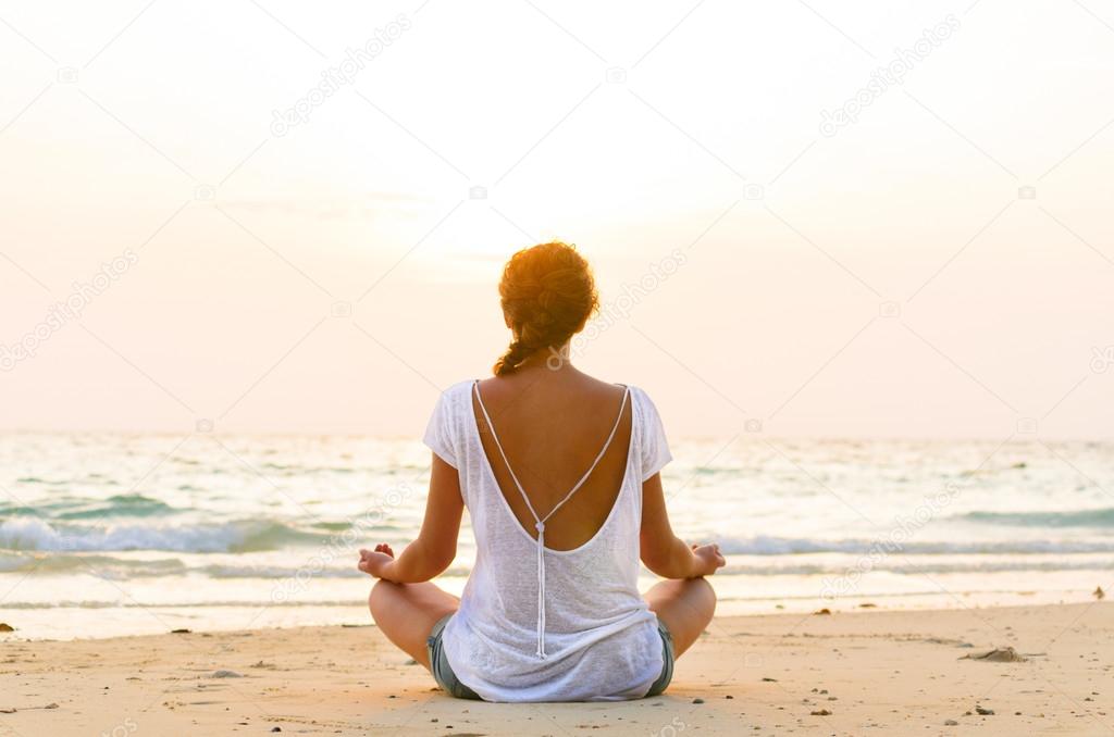 sitting on beach at sunrise