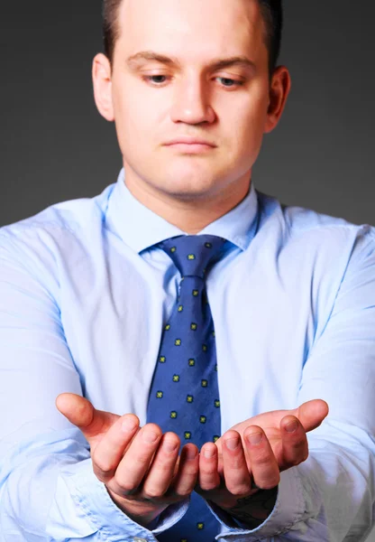 Businessman is holding empty space — Stock Photo, Image