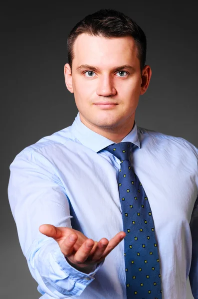 Businessman is holding empty space — Stock Photo, Image