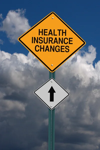 Health insurance changes ahead roadsign — Stock Photo, Image