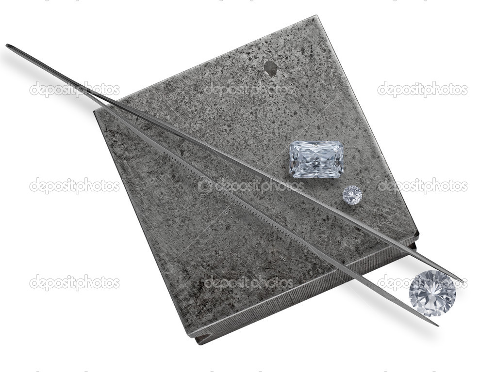 diamonds and tweezers on a jeweler anvil