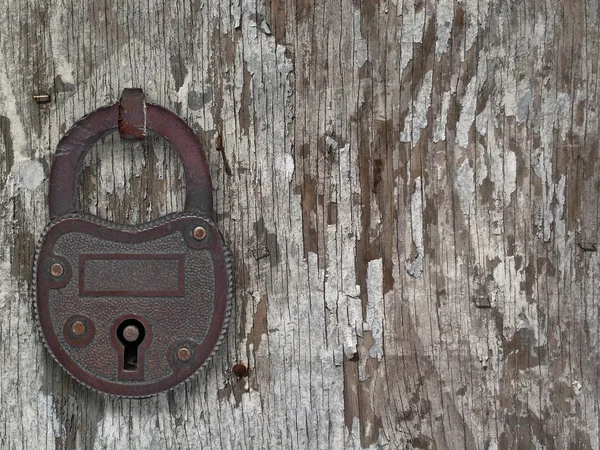 Vintage padlock on a old door — Stock Photo, Image