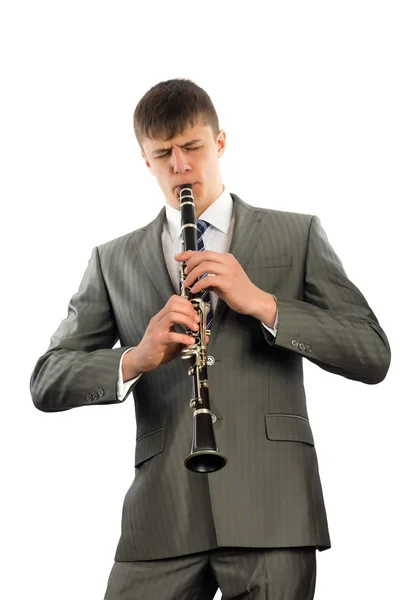 Young musician plays the clarinet — Stock Photo, Image