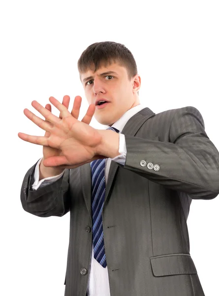 Young businessman defending himself — Stock Photo, Image