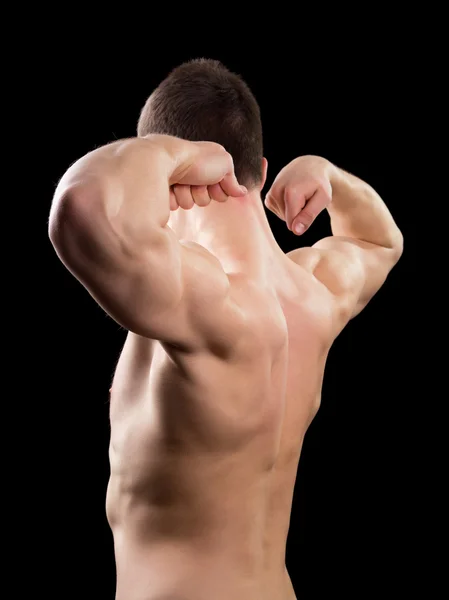 Man visar biceps — Stockfoto